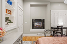 Mainfloor bedroom 2-sided fireplace