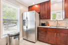 Kitchen featuring stainless refrigerator