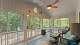 Woodsy view in sunroom.