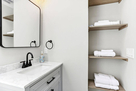Bathroom area with inbuilt shelves