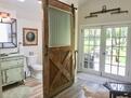 Full bathroom, sitting area, overlooking priv
