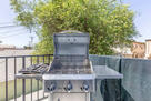 New propane BBQ grill in spacious balcony