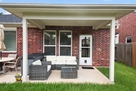 Covered back patio with sitting area