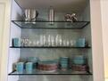 Glass shelving in kitchen