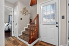 Stairs to the Master Bedroom 1 and door to ba