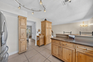 Kitchen has custom cabinets with a pantry and
