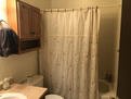 bathroom with tub and shower