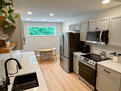 Spacious galley style kitchen with lots of na