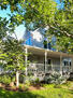 Front Exterior with mature trees and garden b