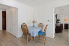 Small 4-chair dinette in corner of family roo