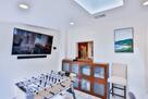 Game zone with foosball table and 70in TV