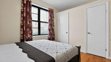 Sunlit Bedroom Featuring Large Windows and Co