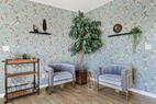 sitting room, backyard is to the left