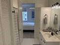 En-suite with large tub and well lit mirror