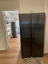Kitchen area with pictures of refrigrators