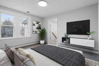 Master bedroom with TV and comfortable bed