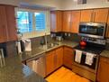Granite stainless kitchen w tile backsplash