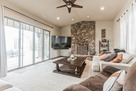 Living rm with wood burning fireplace
