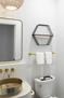Gold-accented powder room with wall mirror
