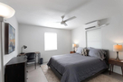 Larger bedroom with queen bed