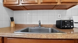 Kitchen with sink, countertop space, and esse