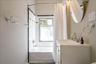 Full bath, with tub, and plenty of light.