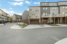 Garage door and deck of townhome.
