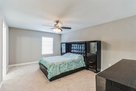 Master bedroom has a dresser and cabinets bui