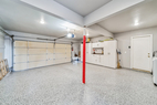 Garage with storage and work bench.