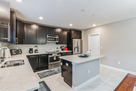 View of kitchen with door into pantry.