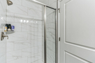Walk in shower in lower level bathroom.