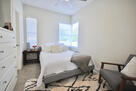 Master bedroom with a queen bed and view of t