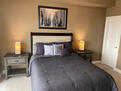 Bedroom with floor to ceiling windows
