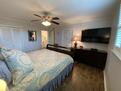Master bedroom with 50” TV and DVD player