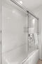 Primary bathroom shower and bathtub
