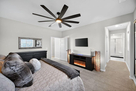 Upstairs owner's suite with electric fire pla