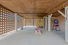 Spacious carport with outdoor shower