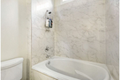 Large marble tub and shower for bedrooms 1 an