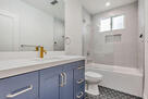 1 of 2 full bathrooms shower and tub
