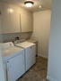 Laundry w/ essential cleaning items and iron.