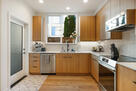 Kitchen with cooking essentials and coffee ma