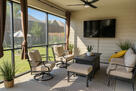 Enclosed patio with fire pit.