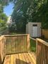 Fenced Back yard area with seating