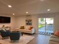 large TV,s seen from kitchen and dining