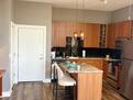 Modern kitchen with central island and seatin