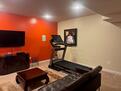 MEDIA ROOM/EXERCISE ROOM: Your off-duty sanct