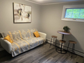 Futon couch seating oppsite fireplace
