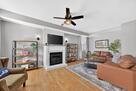 Living Room with library, and fireplace