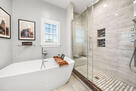 Soaking tub and frameless glass shower