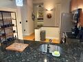 Kitchen with shelving for dishes and glasswar